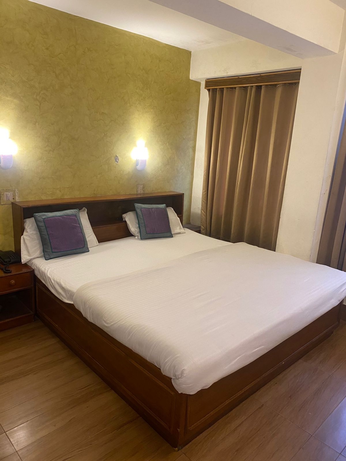 Standard room with wood feature wall at Hotel Woodland Shimla